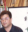 <John Uske with new electric system he built>