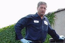 <John Uske repairing an AC system>