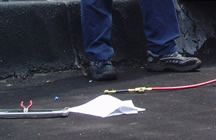 <John Uske repairing an AC system>