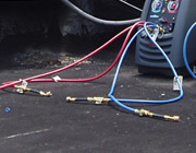 <John Uske repairing an AC system>