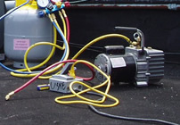 <John Uske repairing an AC system>